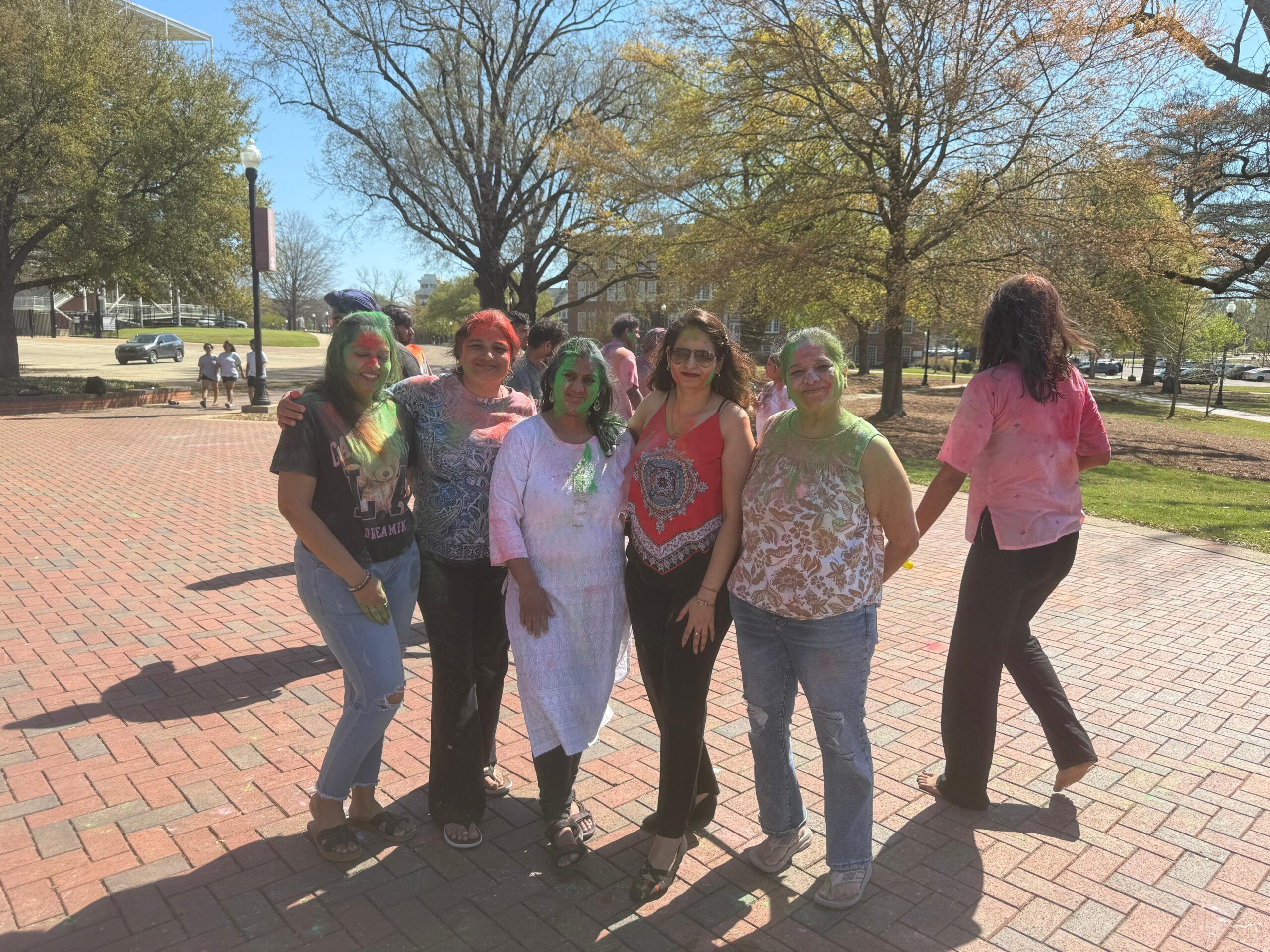 People posing with holi colors